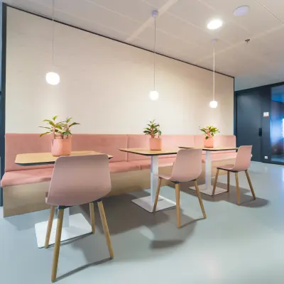 Stylish office space with modern furnishing at Bargelaan 200, Leiden, available for rent. Ideal for workspaces, featuring sleek tables and contemporary seating.