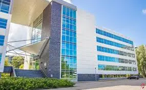 Exterior view of the office building at Mendelweg 30, Leiden, highlighting modern architecture and large glass windows for office space rental.