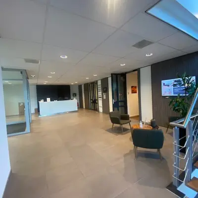 Office space at Mendelweg 30, Leiden, featuring a modern reception area with seating, ideal for rent office space seekers.