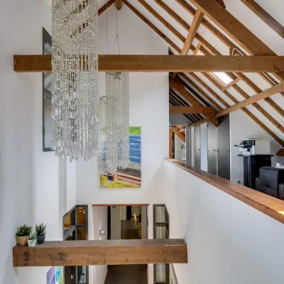Interior view of Hamersveldseweg 120, Leusden, showcasing an office space rental with modern decor and wooden beams.