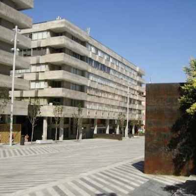 Exterior view of office building at Plaza Santa María Soledad Torres Acosta 1, Madrid Center showcasing modern architecture and spacious surroundings.
