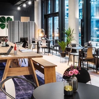 Chic office space available for rent at Rosenheimer Straße 143C, München Werksviertel, featuring modern furnishings and vibrant decor, ideal for workspaces.