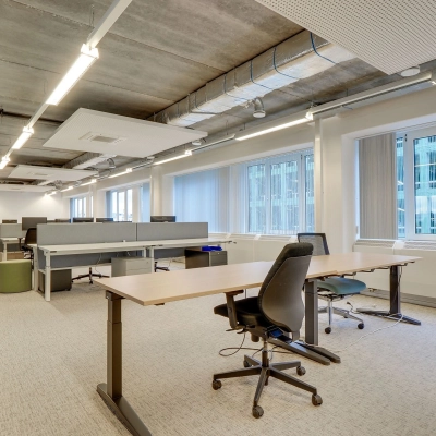 Spacious office interior at Zoomstede 19, Nieuwegein with modern furnishings and large windows. Ideal for those seeking office space rental. Features adjustable desks and ergonomic chairs in an open floor plan.