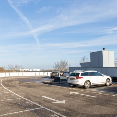 Parking area at Veengang 1, Oosterwolde, offering convenient access to rent office space in the building.