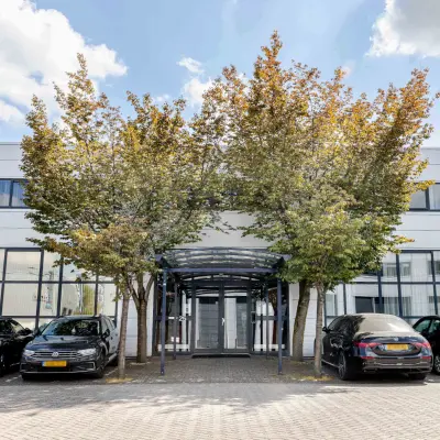 Exterior view of the office at Leeghwaterstraat 25, Reeuwijk, featuring a modern facade and parking area.