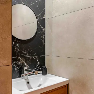 Bathroom area with a modern sink and stylish mirrored wall at Leeghwaterstraat 25, ideal for an office to rent in Reeuwijk.