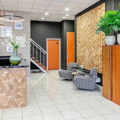 Bright and inviting entrance at Leeghwaterstraat 25, Reeuwijk with modern decor and plants, ideal for renting office space.