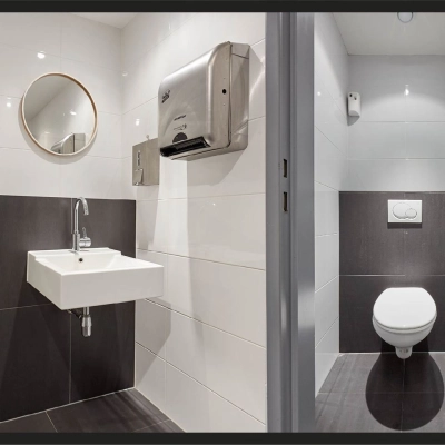 Rijswijk office space rental at Patrijsweg 62, featuring a modern restroom with sleek fixtures and tiled surfaces.