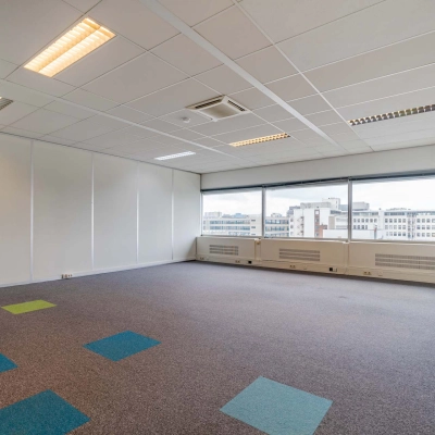 Bright office space at Polakweg 7, Rijswijk, featuring large windows with city views, suitable for office to rent.