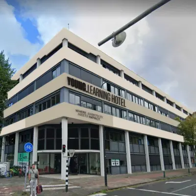 Exterior view of a multifunctional building at Volmerlaan 7, Rijswijk. The modern design offers potential for office to rent, with easy access and amenities.