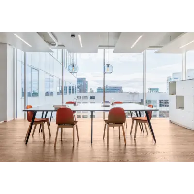 Bright and modern office space rental in Rotterdam Alexander, featuring a spacious meeting area with large windows and contemporary furnishings.