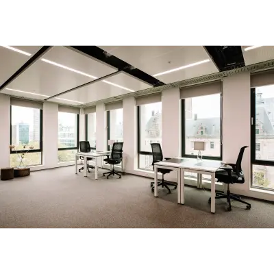 Bright office space at Coolsingel 65, Rotterdam Center with large windows and modern furnishings, perfect for office space rental.