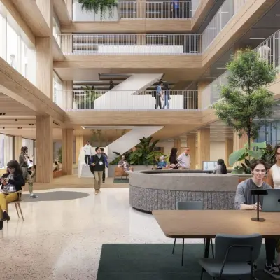 Spacious office interior at Coolsingel 75, Rotterdam Center, featuring an open floorplan with people working and networking. Ideal for those seeking office space rental opportunities.