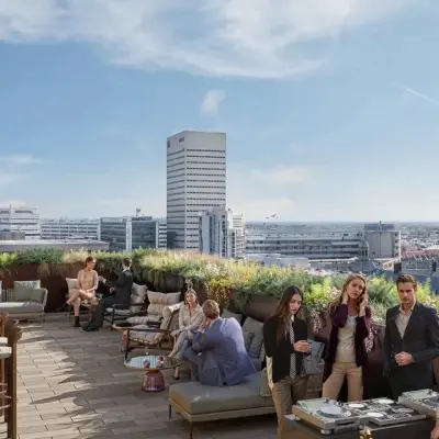 Rooftop terrace at Coolsingel 75, Rotterdam Center with people networking and enjoying a casual gathering. Ideal for office space rental events or informal meetings.