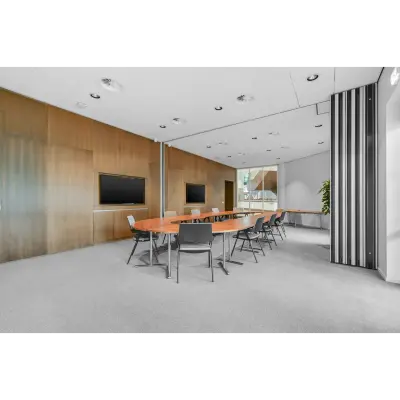 Contemporary office space at Weena 290, Rotterdam Central Station with tables and chairs, ideal for office space rental or office to rent opportunities.