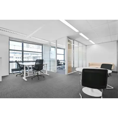 Spacious office to rent at Weena 290, Rotterdam Central Station with modern furniture, large windows, and ample natural light. Ideal for office space rental.