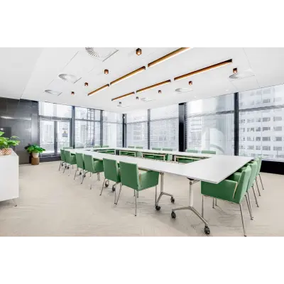 Spacious, well-lit conference room at Weena 505, Rotterdam Central Station with large windows and modern furnishings, ideal for office space rental.