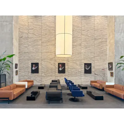 Modern furnished office lounge at Wilhelminakade 173, Rotterdam Kop van Zuid, featuring contemporary seating and stylish decor. Ideal for office space rental.