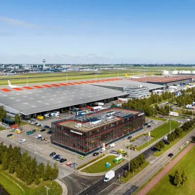 Aerial view of office space at Folkstoneweg 2-56, Schiphol Airport, surrounded by parking and industrial facilities.