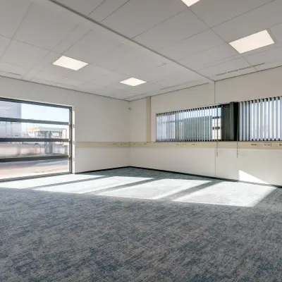 Bright office space available for rent at Fischerpad 106, Sittard with large windows allowing abundant natural light.