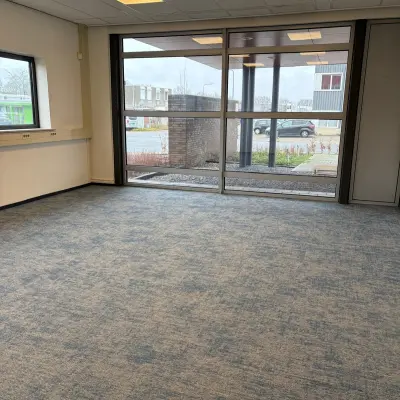 Spacious office to rent at Fischerpad 106, Sittard, featuring large windows for natural light, ideal for office space rental.