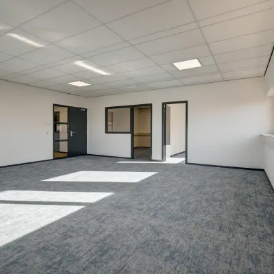 Bright office space at Fischerpad 106, Sittard with large windows and modern lighting, available for rent.
