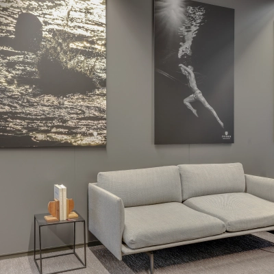 Furnished office space at Kalvermarkt 53, The Hague Center, featuring a modern grey sofa and art decor, ideal for rental or leasing opportunities.