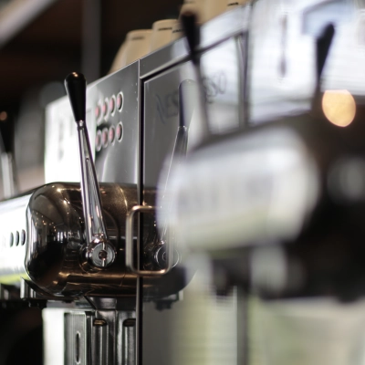 Close-up of coffee machines in an office space available for rent at President Kennedylaan 19, The Hague Statenkwartier.