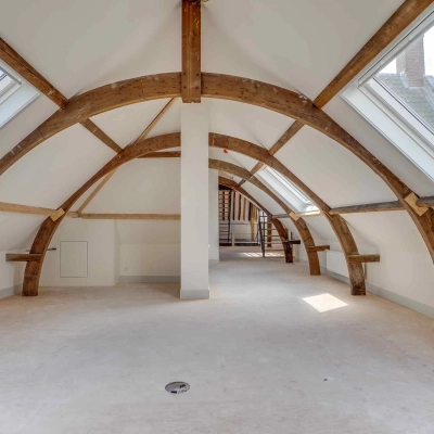 Spacious attic office space with wooden beams and skylights at Brigittenstraat 22, Utrecht Center, ideal for unique office space rental.