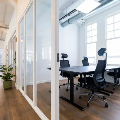 Bright office space with sleek furnishings and large windows at Oudegracht 161, Utrecht Center, ideal for office space rental.