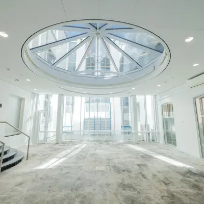 Spacious office interior at Moreelsepark 1, Utrecht Central Station, featuring a large skylight, perfect for office space rental.