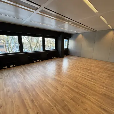 Spacious office to rent at Bernadottelaan 13, Utrecht Kanaleneiland with large windows and wooden flooring, perfect for flexible office space rental opportunities.