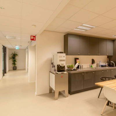 Furnished office kitchenette at Atoomweg 400, Utrecht Lage Weide, ideal for office space rental with seating and appliances.