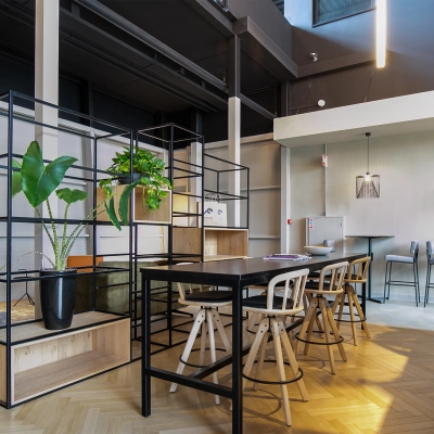 Modern office space with sleek furnishings and green plants at Atoomweg 63 in Utrecht Lage Weide, suitable for those seeking office space rental.