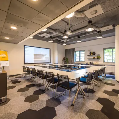 Stylish conference room with modern decor and seating for meetings at Goeman Borgesiuslaan 77 in Utrecht North. Ideal for those seeking office space rental with a professional environment.