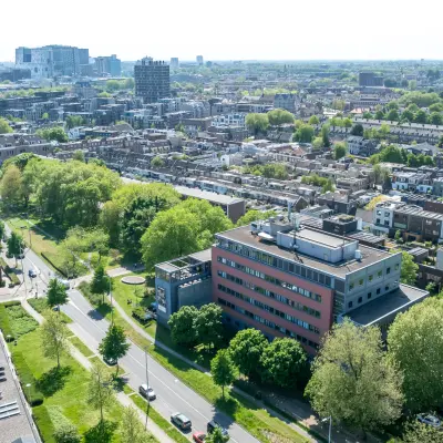 Aerial view of the office building located at Goeman Borgesiuslaan 77 in Utrecht North, surrounded by greenery and urban landscape.