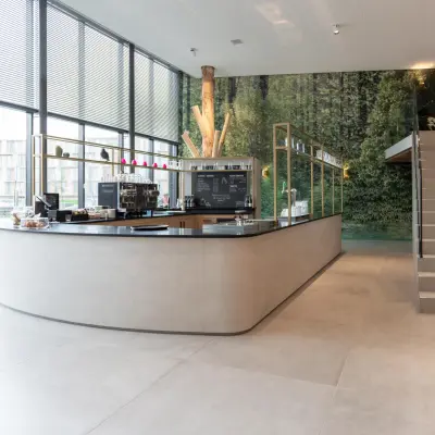 Bright office space with large windows, modern design featuring a reception area with a counter, located at Van Deventerlaan 31-51 in Utrecht Papendorp. Ideal for office space rental.