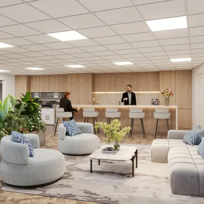 Modern office space with stylish furnishings, featuring a sitting area and people engaging in a meeting, located at Newtonlaan 115, an ideal office to rent in Utrecht Rijnsweerd.