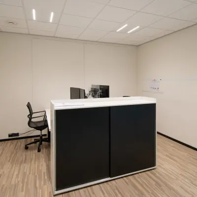 Office space rental at Gildestraat 13, Velp featuring a minimalist interior with a desk and chair, suitable for businesses seeking an office to rent.