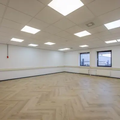 Spacious, well-lit office space with wooden flooring and ceiling lights at Keizersveld 47, Venray, ideal for office space rental.