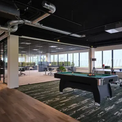Modern office space with sleek workstations and a pool table, suitable for office space rental and creative work environment at Havenweg 24, Vianen Utr.