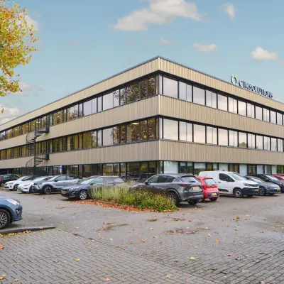 Exterior view of an office building located at Havenweg 24, Vianen Utr, ideal for office space rental with ample parking.