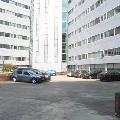 Parking area of the office building at Regulusweg 11 in Voorburg, suitable for those seeking convenient office space rental.