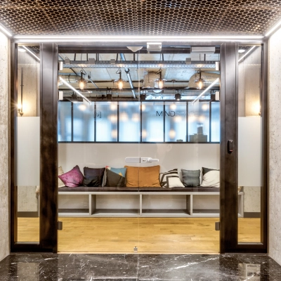 Cozy office space at Koszykowa 65 in Warsaw Śródmieście with a modern design, featuring comfortable seating. Ideal for those looking to rent office space with unique style.