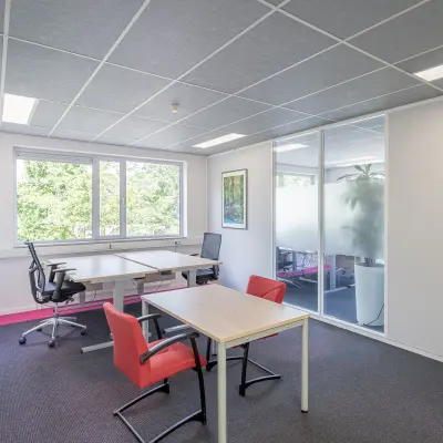 Bright office space at Molenweer 2 in Wateringen, featuring large windows and modern furnishings, now available for rent. Ideal for those seeking office space rental with ample natural light.
