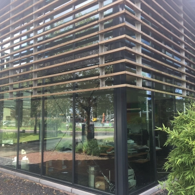 Exterior of an office building at M.A. Reinaldaweg 2d in Woerden, showcasing modern glass architecture suitable for office space rental.