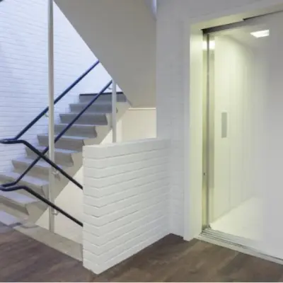 Unfurnished office interior at Pompmolenlaan 9 features an elevator and staircase, ideal for office space rental.