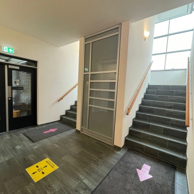Entrance area at Baron de Coubertinlaan 35, Zoetermeer, featuring clean stairs and signage ideal for office space rental.