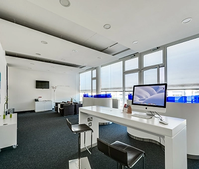 Modern office space at Badenerstrasse 47, Zürich Center with ample natural light, sleek furnishings, and a contemporary design. Ideal for office space rental.