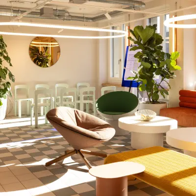 Bright office space at Beethovenstrasse 48, Zürich Enge featuring modern furnishings, ample seating, and large windows offering natural light, perfect for rent office space needs.